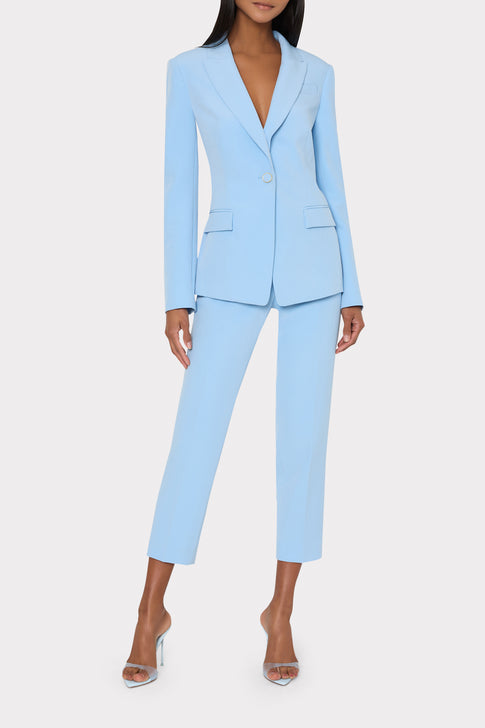 Light blue suit worn by a model on a white background