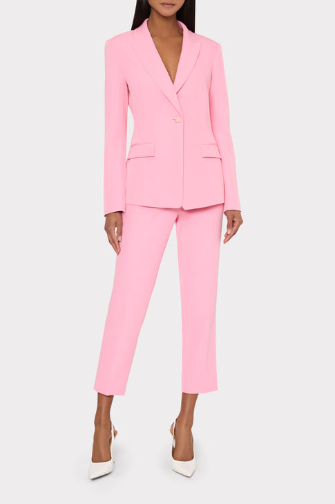 Pink suit with matching pants and blazer on a white background